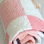 Create Cozy Vibes with the Delightful Pink Checkerboard Quilt