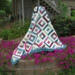 Crafting Memories with the Petunia Strings Quilt: A Journey into Whimsy